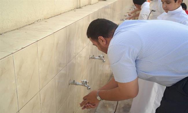 هل يجوز المسح على الملابس عند الوضوء في العمل؟.. الإفتاء تجيب