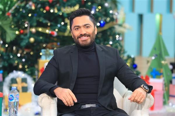 تامر حسني مع منى الشاذلي ليلة رأس السنة
