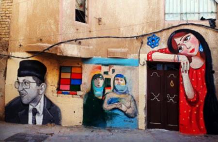 بأيدي فنانة عراقية.. جداريات ملونة تنشر البهجة في شوارع بغداد