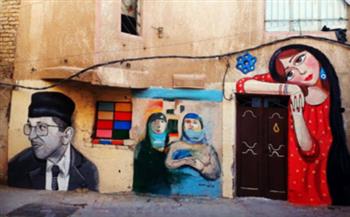   بأيدي فنانة عراقية.. جداريات ملونة تنشر البهجة في شوارع بغداد