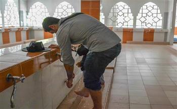 هل تدليك القدمين والتخليل بين الأصابع شرط لصحة الوضوء؟