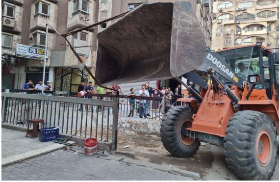 رفع 1200 حالة إشغال وفتح 3 جراجات مغلقة أسفل عقارات بالجيزة