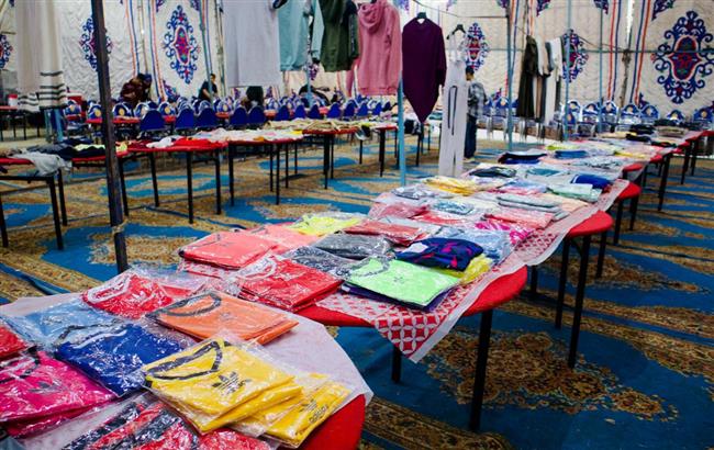 "القبة الخضراء ببني سويف" توزع 1800 قطعة ملابس جديدة على الأهالي