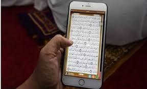 هل الوضوء شرط في قراءة القرآن من الموبايل؟