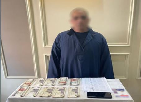 ضبط أحد الأشخاص حال محاولته شراء أصوات الناخبين بالمنيا