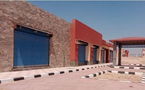 تسليم 266 قطعة أرض سكنية لمستحقيها وبيع 7 محال تجارية وصيدلية بمدينة ملوي الجديدة